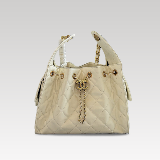 Chanel drawstring bucket wrapped in beige