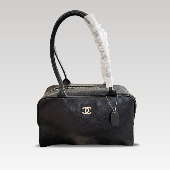Chanel black and gold bowling underarm bag
